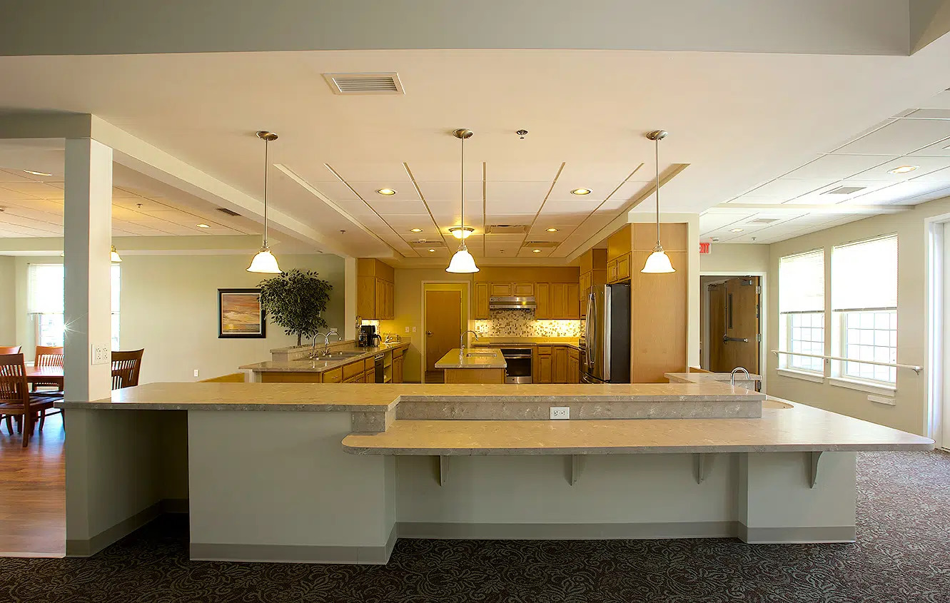 An open cottage kitchen with a large island